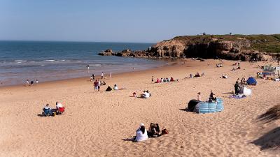 Sunbathers enjoying Sandhaven Beach